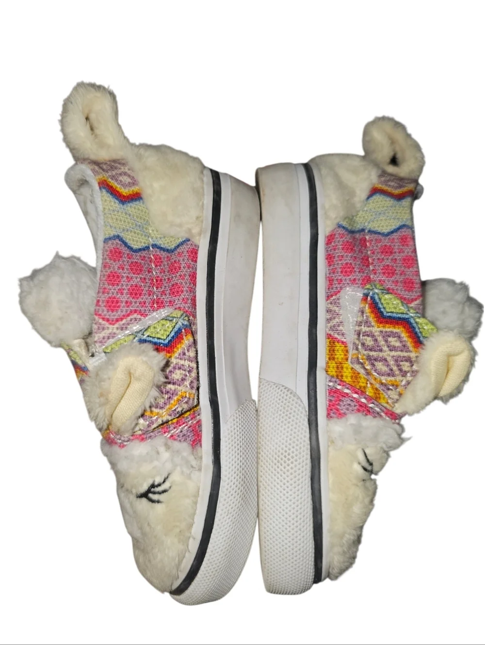 Vans Slip-On V Alpaca sneakers featuring a faux fur llama design.